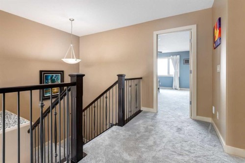 7 Sunset Way, Cochrane, AB - Indoor Photo Showing Other Room