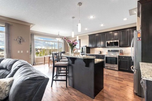 7 Sunset Way, Cochrane, AB - Indoor Photo Showing Kitchen With Stainless Steel Kitchen With Upgraded Kitchen
