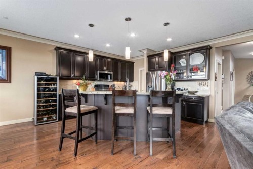 7 Sunset Way, Cochrane, AB - Indoor Photo Showing Kitchen With Upgraded Kitchen