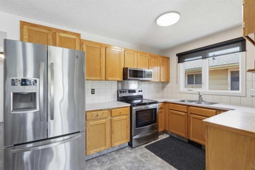 1420 Marlyn Way Ne, Calgary, AB - Indoor Photo Showing Kitchen With Double Sink