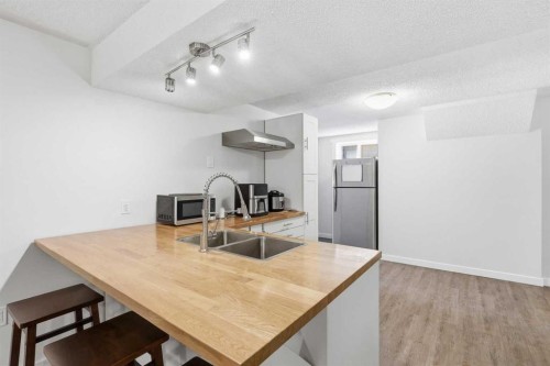 1420 Marlyn Way Ne, Calgary, AB - Indoor Photo Showing Kitchen With Double Sink