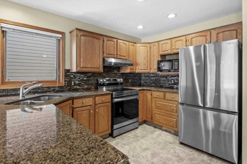100 Macewan Park Manor Nw, Calgary, AB - Indoor Photo Showing Kitchen With Stainless Steel Kitchen With Double Sink