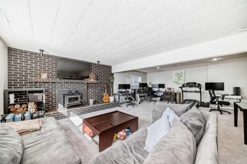 47 Coleridge Crescent Nw, Calgary, AB - Indoor Photo Showing Living Room With Fireplace