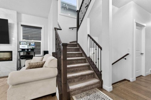 49 Redstone Heath Ne, Calgary, AB - Indoor Photo Showing Other Room With Fireplace