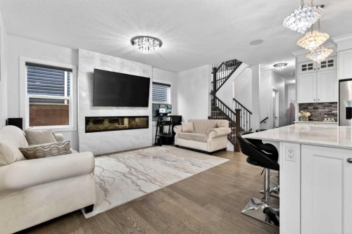 49 Redstone Heath Ne, Calgary, AB - Indoor Photo Showing Living Room With Fireplace