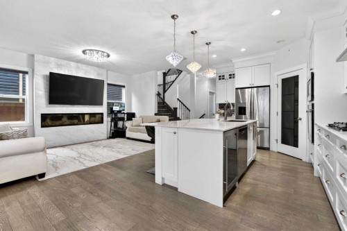 49 Redstone Heath Ne, Calgary, AB - Indoor Photo Showing Kitchen With Fireplace With Stainless Steel Kitchen With Upgraded Kitchen