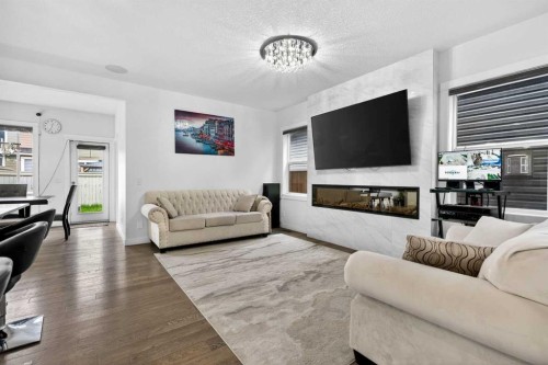 49 Redstone Heath Ne, Calgary, AB - Indoor Photo Showing Living Room With Fireplace