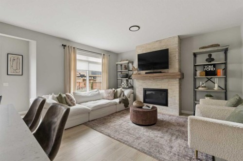 630 Kingsmere Way Se, Airdrie, AB - Indoor Photo Showing Living Room With Fireplace