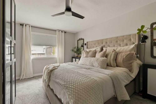 630 Kingsmere Way Se, Airdrie, AB - Indoor Photo Showing Bedroom