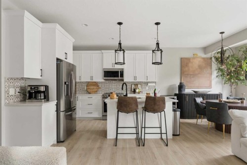 630 Kingsmere Way Se, Airdrie, AB - Indoor Photo Showing Kitchen With Upgraded Kitchen