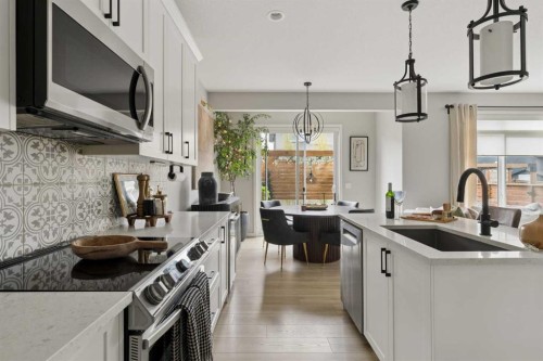 630 Kingsmere Way Se, Airdrie, AB - Indoor Photo Showing Kitchen With Upgraded Kitchen
