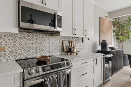 630 Kingsmere Way Se, Airdrie, AB - Indoor Photo Showing Kitchen With Upgraded Kitchen