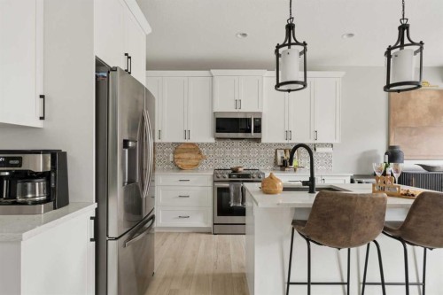 630 Kingsmere Way Se, Airdrie, AB - Indoor Photo Showing Kitchen With Upgraded Kitchen