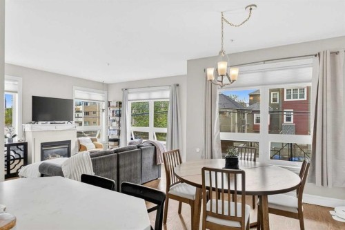 205-2 14 Street Nw, Calgary, AB - Indoor Photo Showing Dining Room With Fireplace