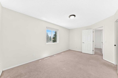 6 Cougarstone Crescent Sw, Calgary, AB - Indoor Photo Showing Other Room