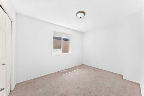 6 Cougarstone Crescent Sw, Calgary, AB - Indoor Photo Showing Other Room