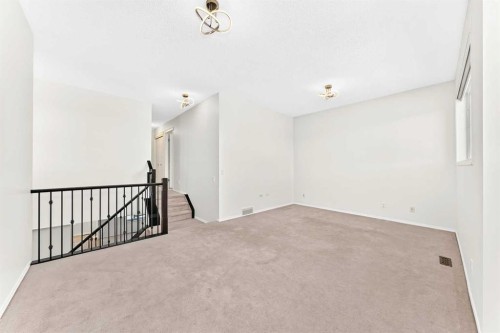 6 Cougarstone Crescent Sw, Calgary, AB - Indoor Photo Showing Other Room