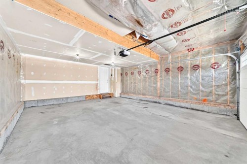 6 Cougarstone Crescent Sw, Calgary, AB - Indoor Photo Showing Garage