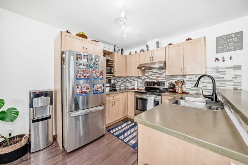 65 Spring Meadows Bay, Okotoks, AB - Indoor Photo Showing Kitchen With Upgraded Kitchen