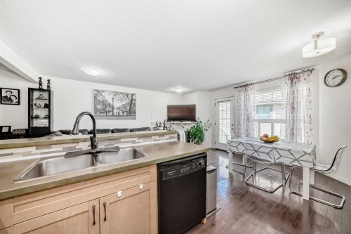 65 Spring Meadows Bay, Okotoks, AB - Indoor Photo Showing Kitchen With Double Sink