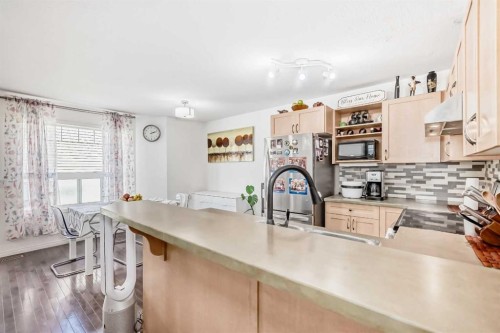 65 Spring Meadows Bay, Okotoks, AB - Indoor Photo Showing Kitchen