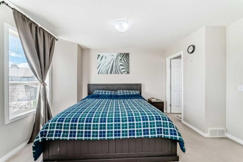 65 Spring Meadows Bay, Okotoks, AB - Indoor Photo Showing Bedroom