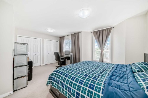 65 Spring Meadows Bay, Okotoks, AB - Indoor Photo Showing Bedroom
