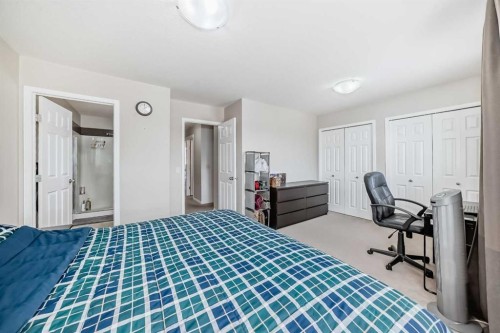 65 Spring Meadows Bay, Okotoks, AB - Indoor Photo Showing Bedroom