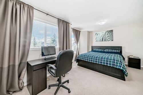 65 Spring Meadows Bay, Okotoks, AB - Indoor Photo Showing Bedroom