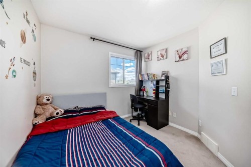 65 Spring Meadows Bay, Okotoks, AB - Indoor Photo Showing Bedroom