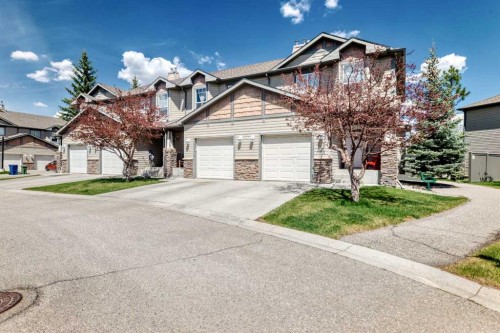65 Spring Meadows Bay, Okotoks, AB - Outdoor With Facade