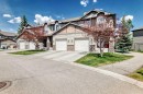 65 Spring Meadows Bay, Okotoks, AB  - Outdoor With Facade 