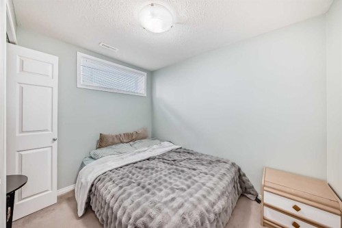 65 Spring Meadows Bay, Okotoks, AB - Indoor Photo Showing Bedroom