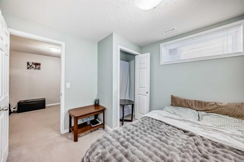 65 Spring Meadows Bay, Okotoks, AB - Indoor Photo Showing Bedroom