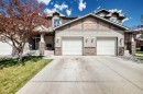 65 Spring Meadows Bay, Okotoks, AB  - Outdoor With Facade 