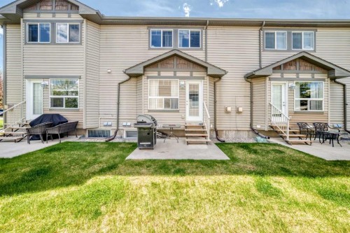 65 Spring Meadows Bay, Okotoks, AB - Outdoor With Deck Patio Veranda