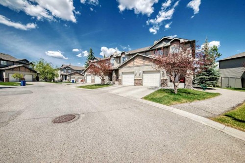 65 Spring Meadows Bay, Okotoks, AB - Outdoor With Facade
