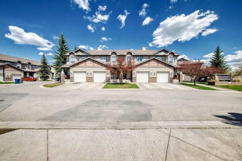65 Spring Meadows Bay, Okotoks, AB - Outdoor With Facade