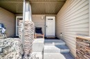 65 Spring Meadows Bay, Okotoks, AB  - Outdoor With Exterior 