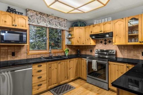 146 Cougar Point Road, Canmore, AB - Indoor Photo Showing Kitchen With Double Sink