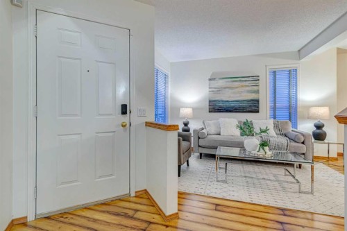 268 Mt Brewster Circle Se, Calgary, AB - Indoor Photo Showing Living Room