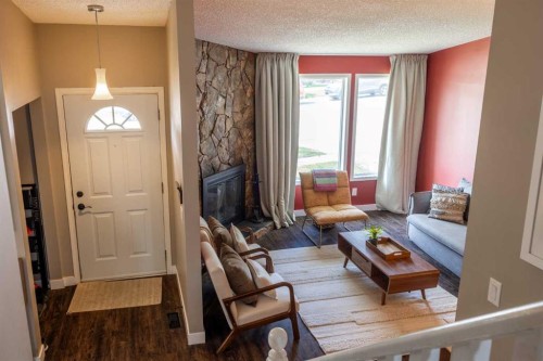 6716 Ranchview Drive Nw, Calgary, AB - Indoor Photo Showing Living Room With Fireplace