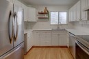 10-707 Westmount Drive, Strathmore, AB  - Indoor Photo Showing Kitchen With Double Sink 