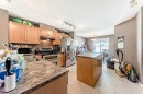 80 Elgin Gardens Se, Calgary, AB  - Indoor Photo Showing Kitchen With Double Sink 