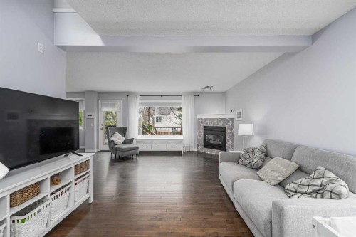 381 Hidden Valley Manor Nw, Calgary, AB - Indoor Photo Showing Living Room With Fireplace