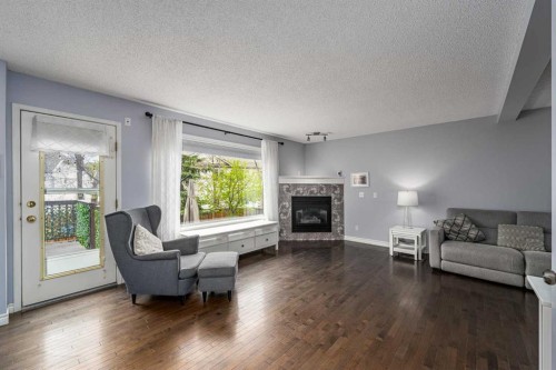 381 Hidden Valley Manor Nw, Calgary, AB - Indoor Photo Showing Living Room With Fireplace