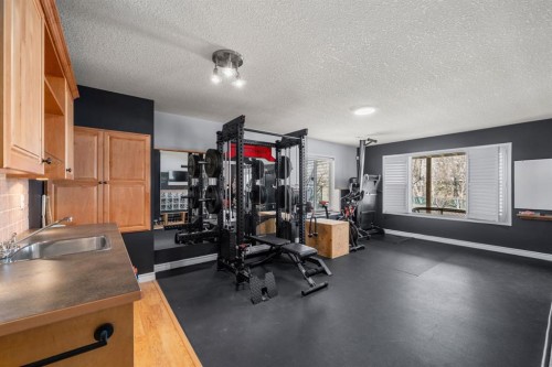 26 Somerset Crescent Sw, Calgary, AB - Indoor Photo Showing Gym Room