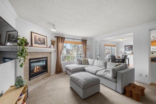 26 Somerset Crescent Sw, Calgary, AB - Indoor Photo Showing Living Room With Fireplace