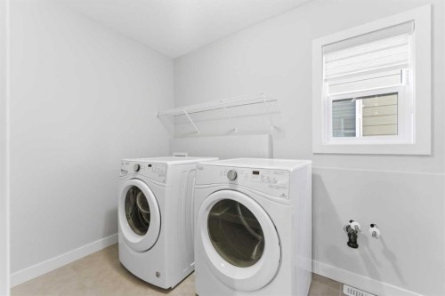 40 Evansfield Manor Nw, Calgary, AB - Indoor Photo Showing Laundry Room
