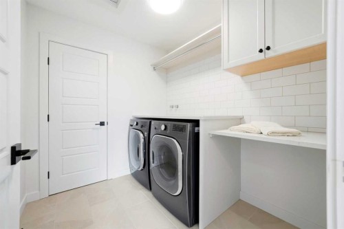24 Monterra Landing, Cochrane Lake, AB - Indoor Photo Showing Laundry Room